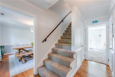 Enter the front door to new carpet, refinished har