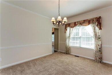 Formal Dining Room right off the kitchen and overlooking one of the 2 decks.