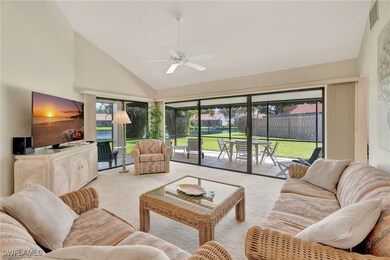 Living room featuring carpet, ceiling fan, high va