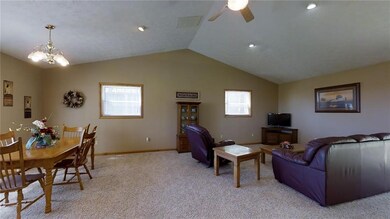 Open concept floor plan and cathedral ceiling make a large great/dining room feel even larger.
