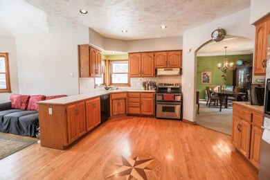 Spacious, open kitchen, custom hardwood floors wit