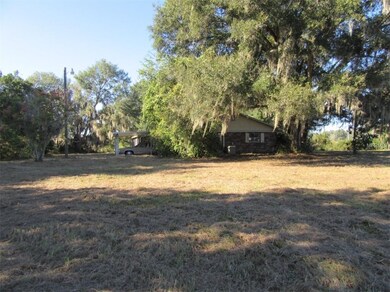 View of side of home from driveway - house sits to