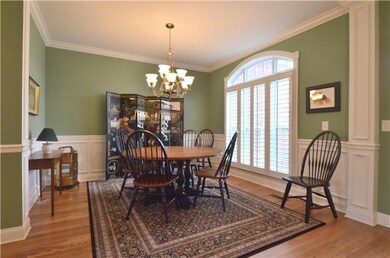 The dining room has nice trim molding, plantation 