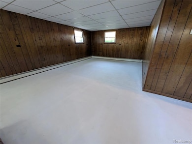 Lower level game room or family room and separate zone with baseboard heating