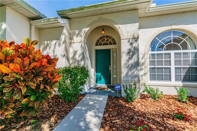 Freshly landscaped entryway adds a pop of color to