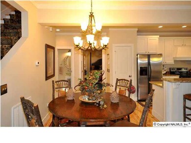 THE DINING ROOM IS 9 X 12 WITH SMOOTH CEILING AND PINE HARDWWOD FLOORING