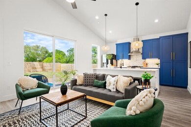 Living room with high vaulted ceiling, ceiling fa