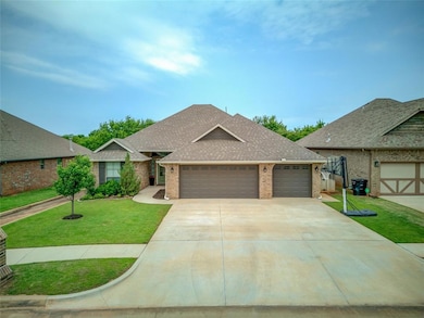 View of front of property with brick siding, a shingled roof, an attached garage, a front yard, and driveway