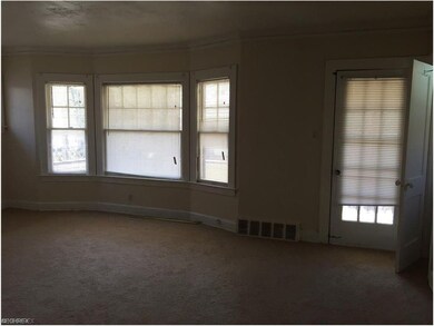 Family-room with door leading to front porch. (sec
