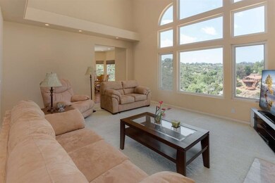 The views from this living room greet you as you e