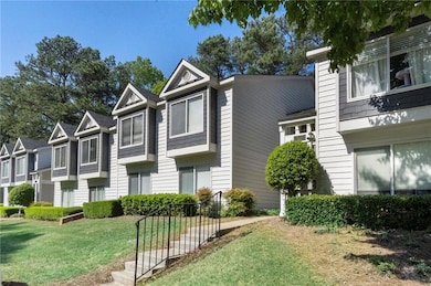 Townhome / multi-family property with a front yard