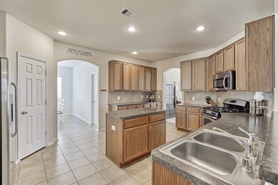 The large kitchen is open concept and has direct access to the large breakfast area and there is also direct access to the formal dining area! The main living area and first floor of the home has great flow and is perfect for entertaining! Lots of space here for everyone!