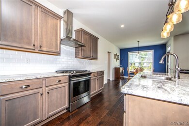 Gourmet Kitchen with Granite, Tile Backsplash, Gas