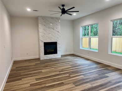 Unfurnished living room with visible vents, reces