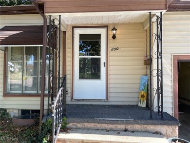 Doorway to property featuring a porch