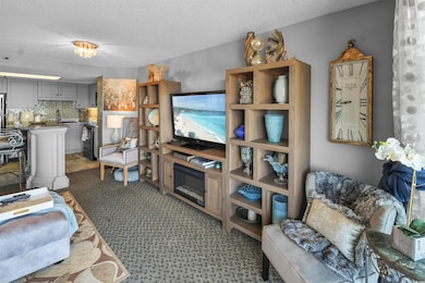 Living area featuring a textured ceiling