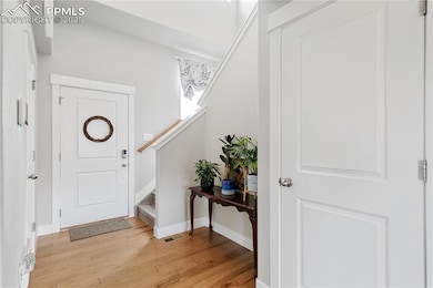 Entrance foyer with lvp flooring, baseboards, and 