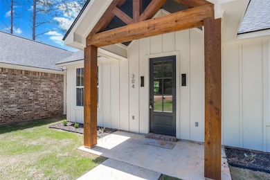 Property entrance featuring a patio area, board an