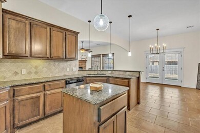 Kitchen featuring granite countertops, a center is