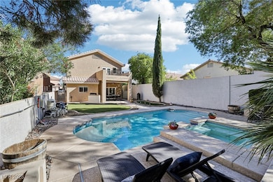 View of swimming pool featuring a patio area, a fenced backyard, a balcony, and a pool with connected hot tub