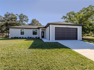 Ranch-style home with stucco siding, an attached g