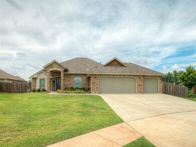 Ranch-style house with a garage and a front yard
