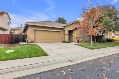The exterior showcases beautiful brick accents. Front landscaping is maintained by the HOA for a consistently manicured look.