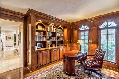Front hall way leads to this handsome den with gle