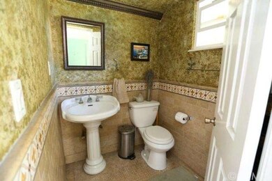 Downstairs half bathroom is remodeled with travert