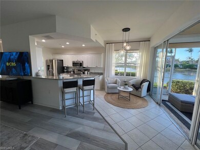 Kitchen with white cabinetry, kitchen peninsula, a