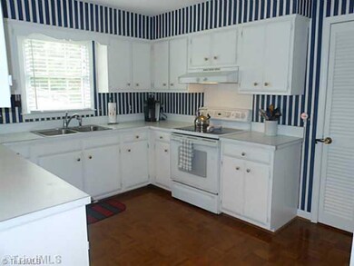 Kitchen. There s abundant cabinet and counter space for the cook!  Appliances include a flat surface range and dishwasher.