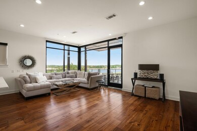 Living room with expansive windows, plenty of nat