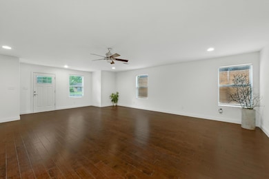 Unfurnished living room with a ceiling fan, reces