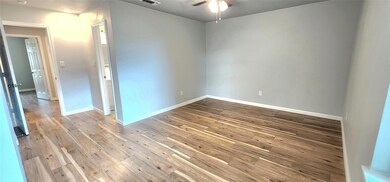 Unfurnished room with hardwood / wood-style floori