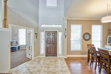 The open high two story entry gives this foyer a grand feel.
