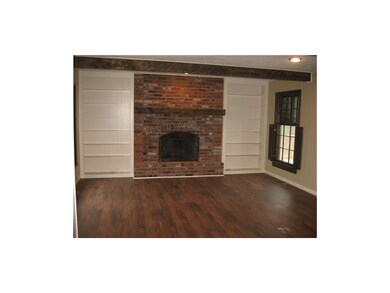 Family Room features new flooring, fireplace and b