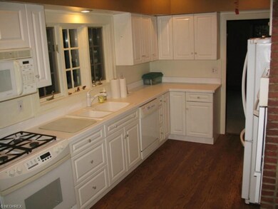 Updated kitchen with beautiful wood floor.  The st