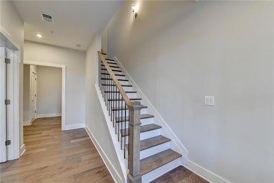 Stairway with light wood-type flooring