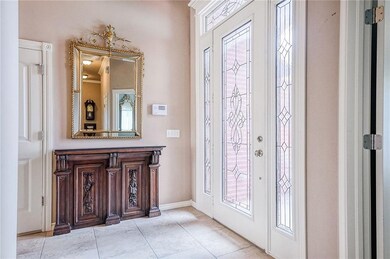 front door lets in tons of light and the foyer is 
