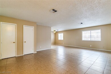 Large living and dining room area with tile floors