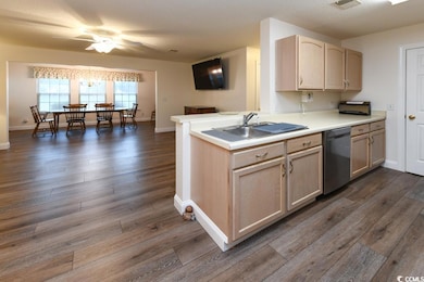 Kitchen with dishwasher, sink, kitchen peninsula, 