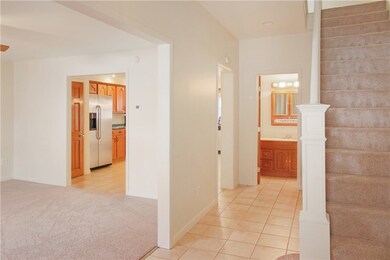 View from front door entryway; half bath located a