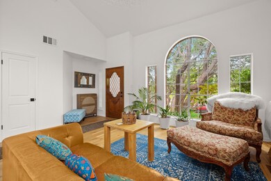 Living area with wood finished floors and high va