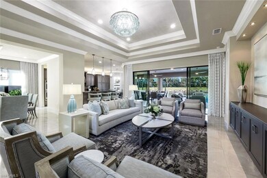 View of open Great room area with crown molding, custom built-in