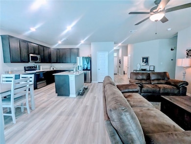 Living area featuring light wood-type flooring, a