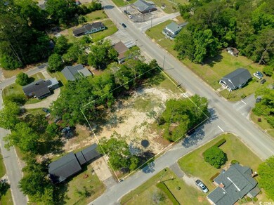 Aerial perspective of suburban area featuring property parcel outlined