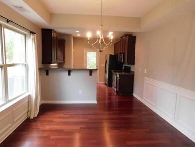 Kitchen with an inviting chandelier, a decorative 
