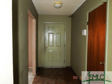Foyer entrance with Living room to left, security 