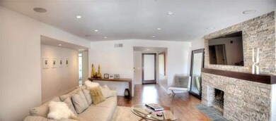 Front door opens to foyer with coat closet and hal