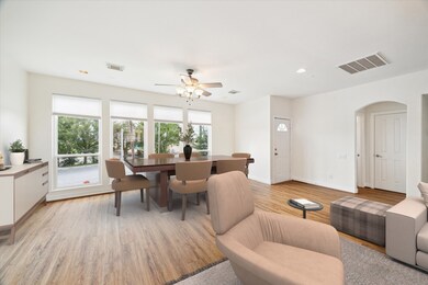 Dining space flows seamlessly from the kitchen, offering functionality and style in one cohesive layout.